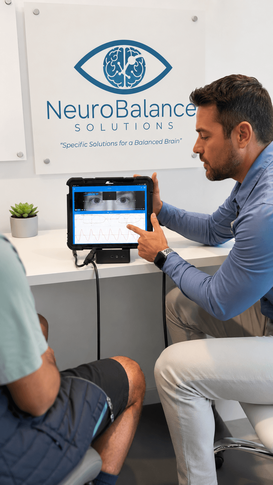Dr. Ryan reviewing VNG findings with a patient at NeuroBalance Solutions.